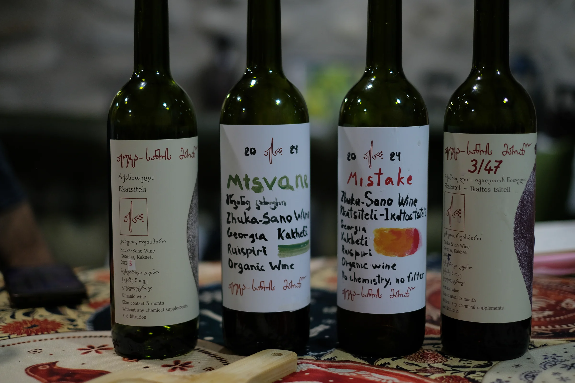 Four bottles of Zhuka-Sano Wine: Rkatsiteli, Mtsvane, Mistake and 3/47.